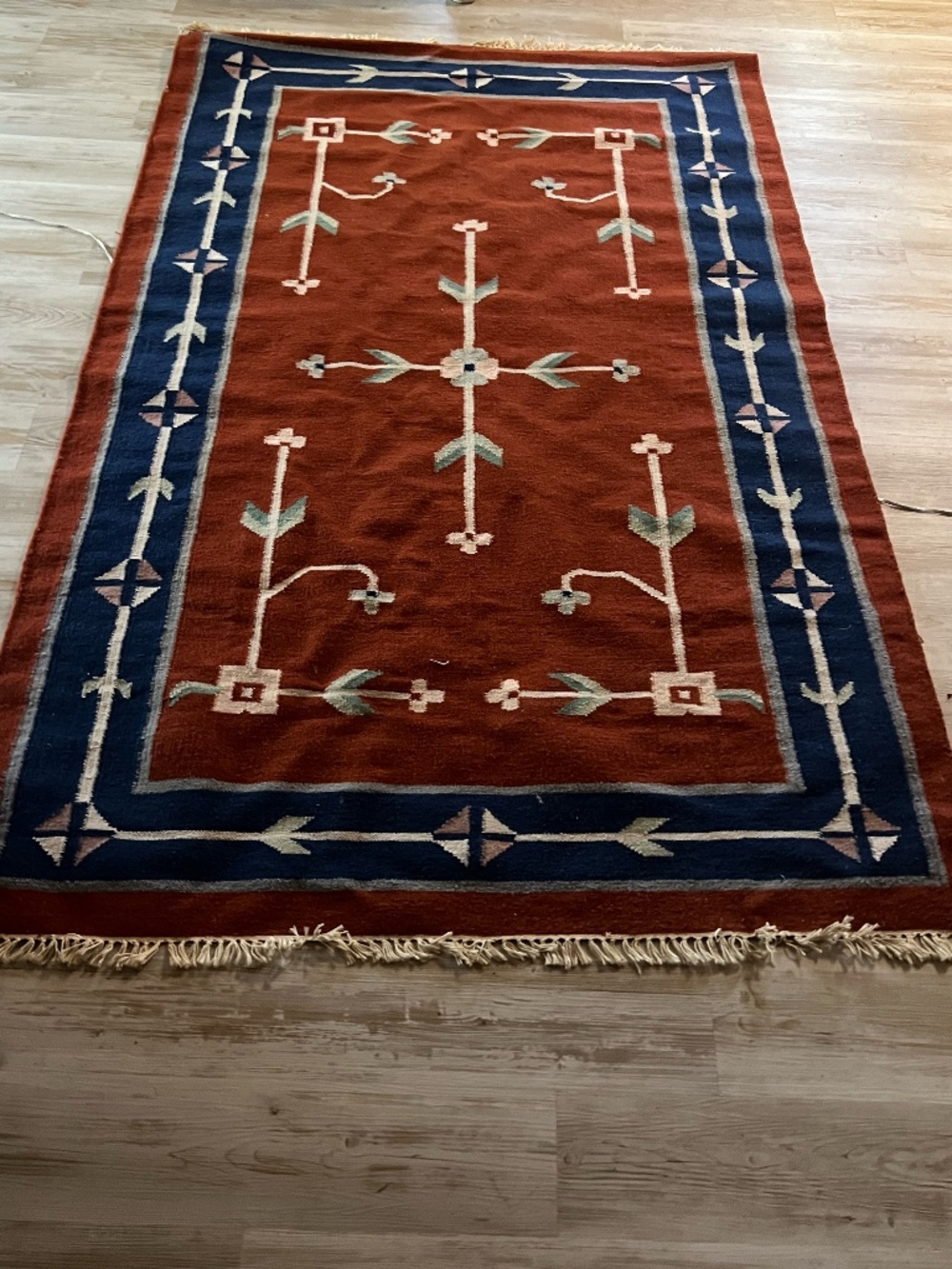 Hand-knotted rich terracotta red wool area rug tribal W geometric tree-of-life